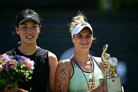 China's Wang Xinyu and winner Czech Republic's Marketa Vondrousova after the women's single final match of the WTA tennis tournament in Berlin on June 22, 2025.