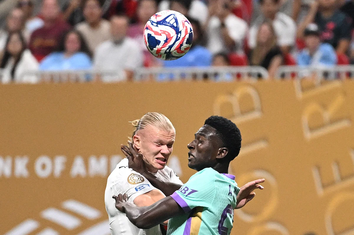 Manchester City's Erling Haaland and Al Ain's Amadu Niang fight for the ball during the FIFA Club World Cup 2025 Group G football match in Atlanta on June 22, 2025.