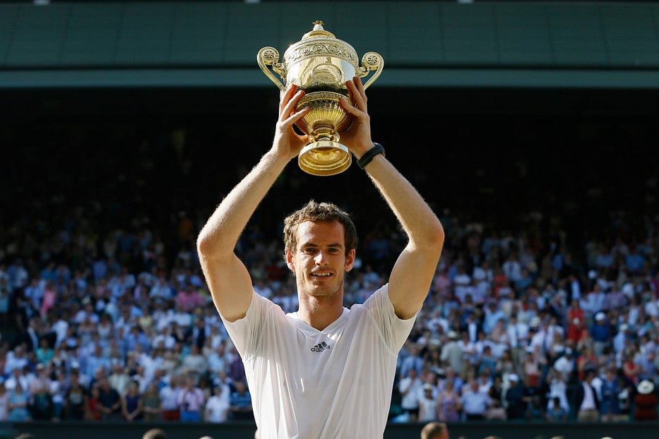 FILE - Andy Murray of Britain poses with the trophy after defeating Novak Djokovic of Serbia in the men