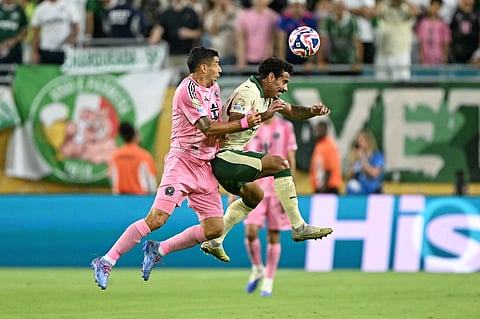 Inter Miami's Uruguayan forward #09 Luis Suarez (L) fights for the ball with Palmeiras' Brazilian midfielder #30 Lucas Evangelista during the FIFA Club World Cup 2025 Group A football match between US Inter Miami and Brazil's Palmeiras at the Hard Rock stadium in Miami on June 23, 2025.