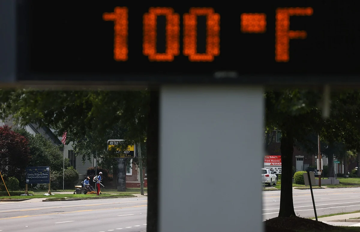 A thermometer reading 100 degrees outside a high school during high temperatures in Columbia, South Carolina, US, on Tuesday, June 24, 2025. The Trump administration has declared a power emergency in the US Southeast as a blistering heat wave strains grids across the country. 