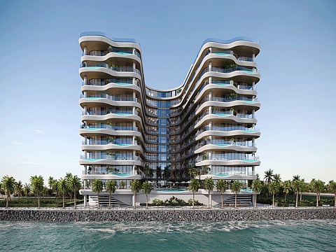 The U-shaped design offers ocean views from all units, with floor-to-ceiling windows and some featuring private terrace pools.