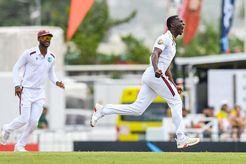 Shamar Joseph (R) of West Indies celebrates the dismissal of Cameron Green of Australia during the first day of the 1st test match at Kensington Oval, Bridgetown, Barbados, on June 25, 2025.