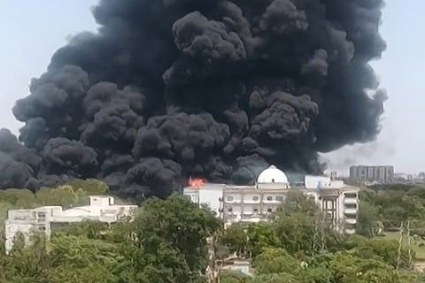 This screengrab from UGC video footage shows smoke rising from a residential area after Air India flight 171 crashed in Ahmedabad on June 12, 2025.