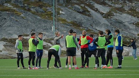 Greenland's football and futsal players huddle during a training session at Nuuk stadium, Greenland.