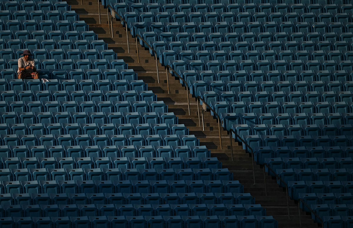 A fan is seen amid empty benches during the Fifa Club World Cup 2025 round of 16 football match between Portugal's Benfica and England's Chelsea at the Bank of America Stadium in Charlotte on June 28, 2025.