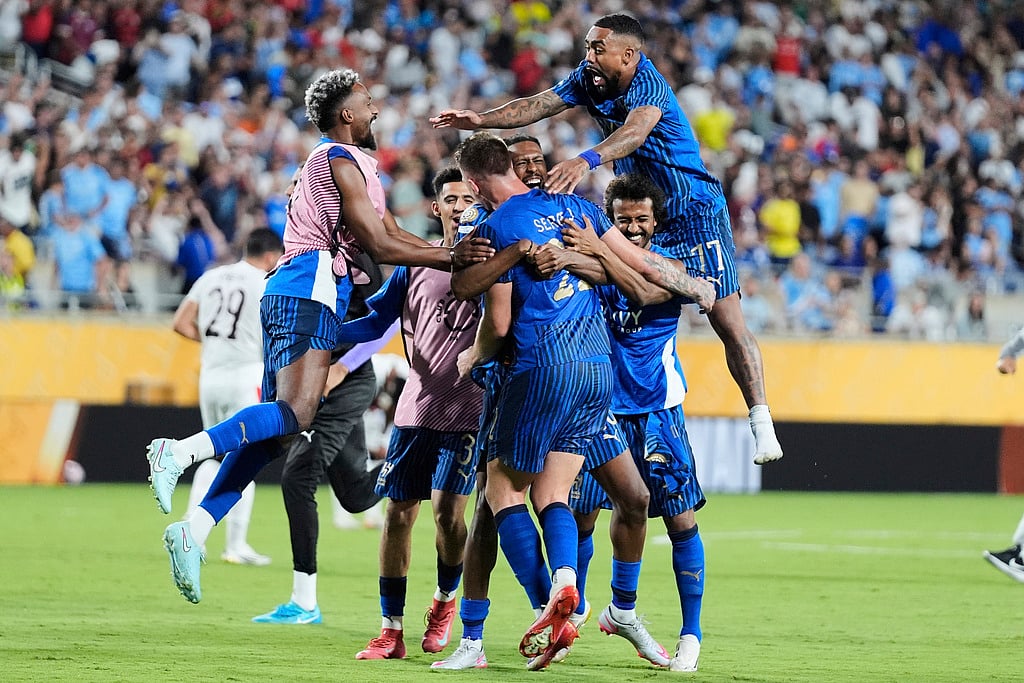Al Hilal players celebrate after defeating Manchester City the Club World Cup round of 16 football match in Orlando, Florida, on June 30, 2025. 