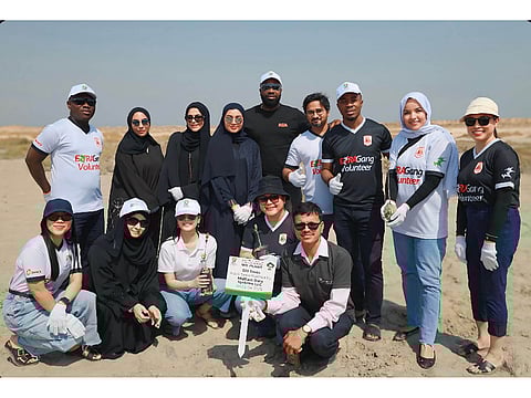 Sahara Energy Resources DMCC employees and EEG officials during the tree planting activity aimed at environmental preservation and enhancing biodiversity in Umm Al Quwain, United Arab Emirate