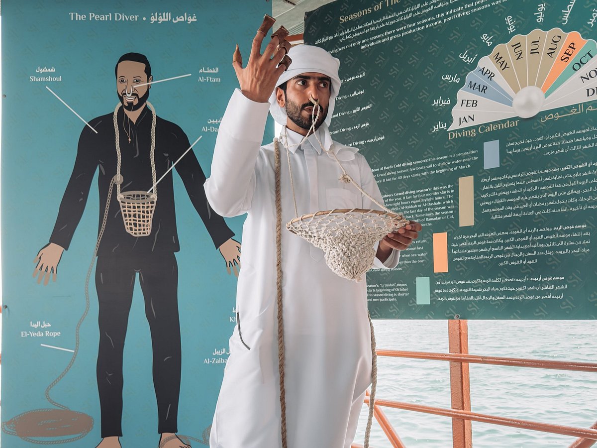 Othman Al Balooshi - Tour Guide at Suwaidi Pearls, explains how pearl divers used to tie a stone, put nose clips and search the seabed for pearls 