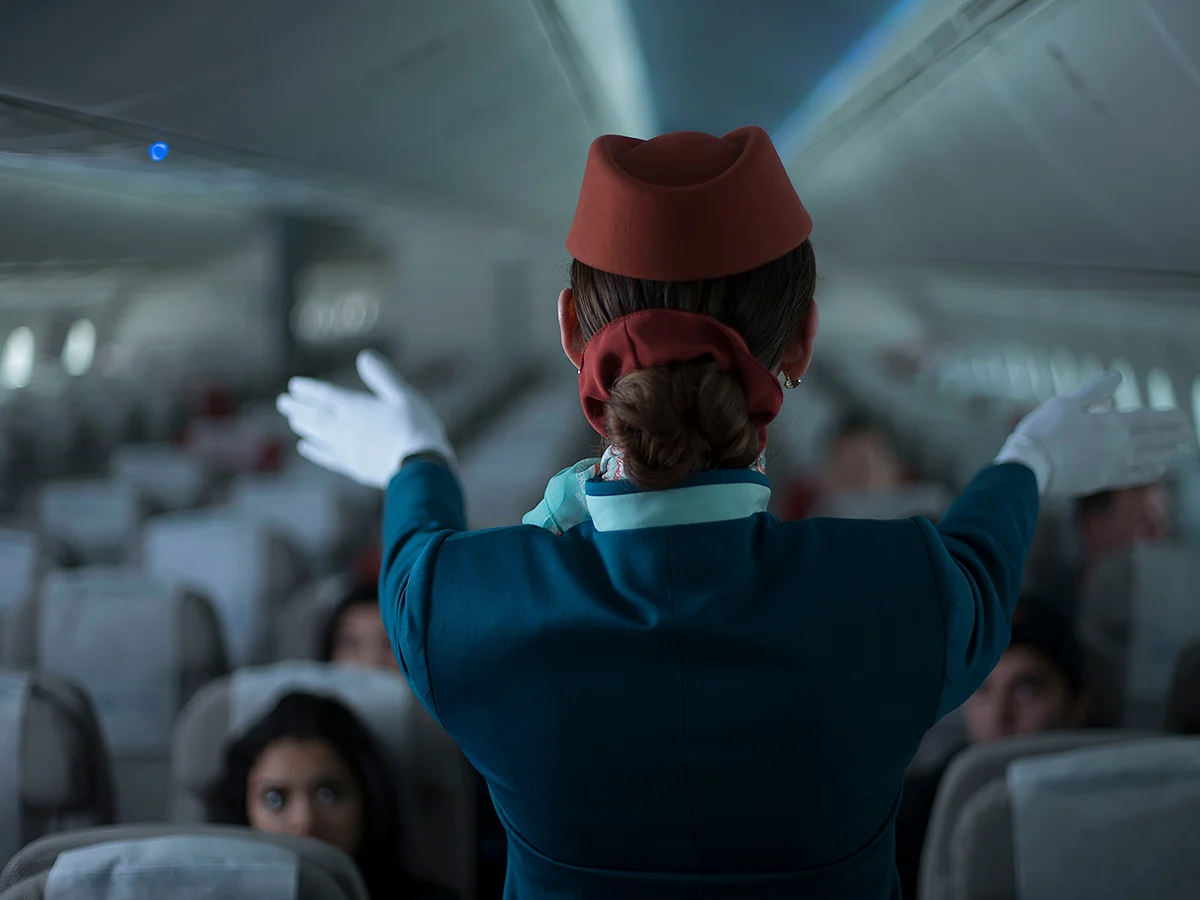 Flight attendants manage a busy environment and are there to help. Politeness and patience go a long way, especially during stressful situations like turbulence or delays.