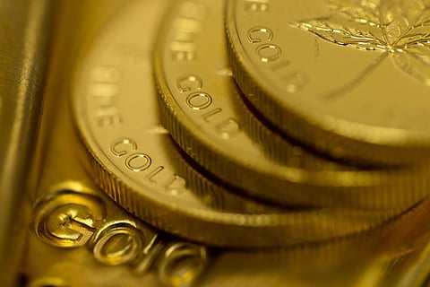 Gold Slides From Record as Precious Metals Join Global Selloff