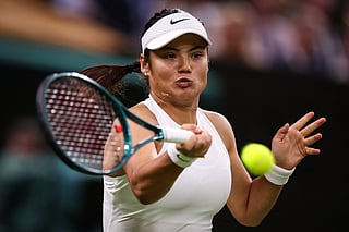 Britain's Emma Raducanu plays a forehand return to Belarus's Aryna Sabalenka during their women's singles third round tennis match on the fifth day of the 2025 Wimbledon Championships at The All England Lawn Tennis and Croquet Club in Wimbledon, southwest London, on July 4, 2025.