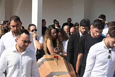 Diogo Jota's wife Rute Cardoso (C,R) and her sister react as former teammates carry the coffin during the funerals of Liverpool's Portuguese forward Diogo Jota and his brother Andre Silva at the Mother Church of Gondomar, on the outskirts of Porto, on July 5, 2025.
