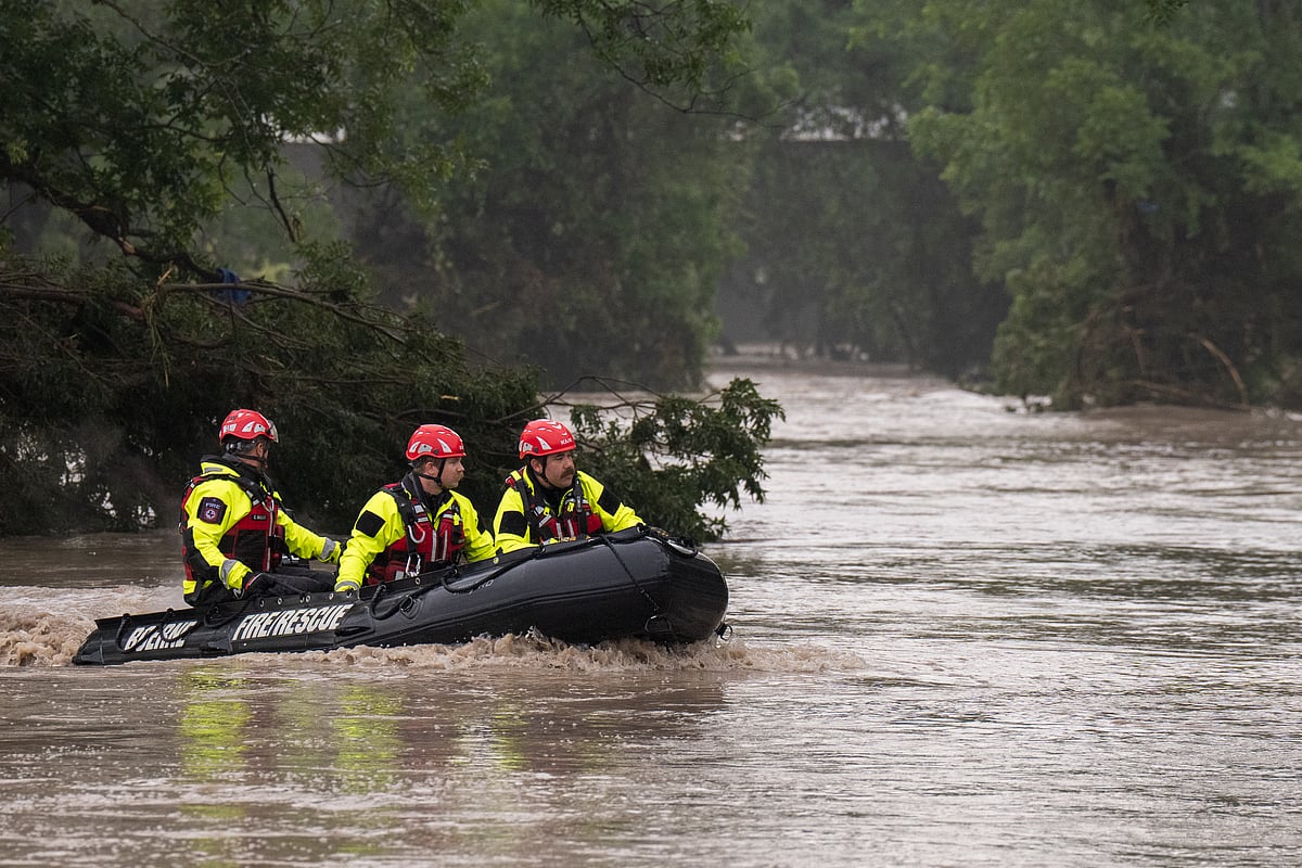 Boerne Search and Rescue teams navigate upstream in an inflatable boat on the flooded Guadalupe River on July 4, 2025 in Comfort, Texas.