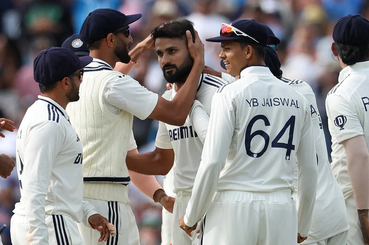 India's Akash Deep (centre) celebrates with teammates after taking the wicket of England's Ben Duckett on Day 4 of the second cricket Test at Edgbaston, Birmingham, on July 5, 2025.