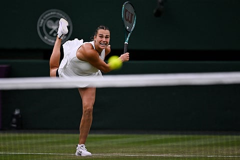 Belarus's Aryna Sabalenka serves to Belgium's Elise Mertens during their women's singles fourth round tennis match on the seventh day of the 2025 Wimbledon Championships at The All England Lawn Tennis and Croquet Club in Wimbledon, southwest London, on July 6, 2025.