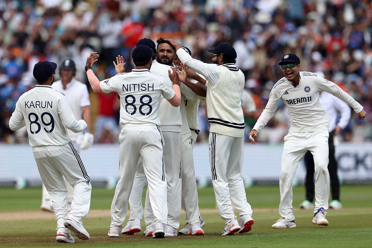 India's Akash Deep (C) is congratulated after trapping England's Harry Brook LBW (leg before wicket) on day five of the second cricket Test match at Edgbaston cricket ground in Birmingham, central England on July 6, 2025.