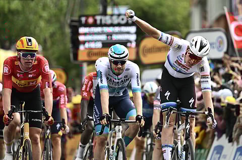 Soudal Quick-Step team's Belgian rider Tim Merlier celebrates winning the 3rd stage of the 112th edition of the Tour de France cycling race, 178.3 km between Valenciennes and Dunkerque (Dunkirk), Northern France, on July 7, 2025.