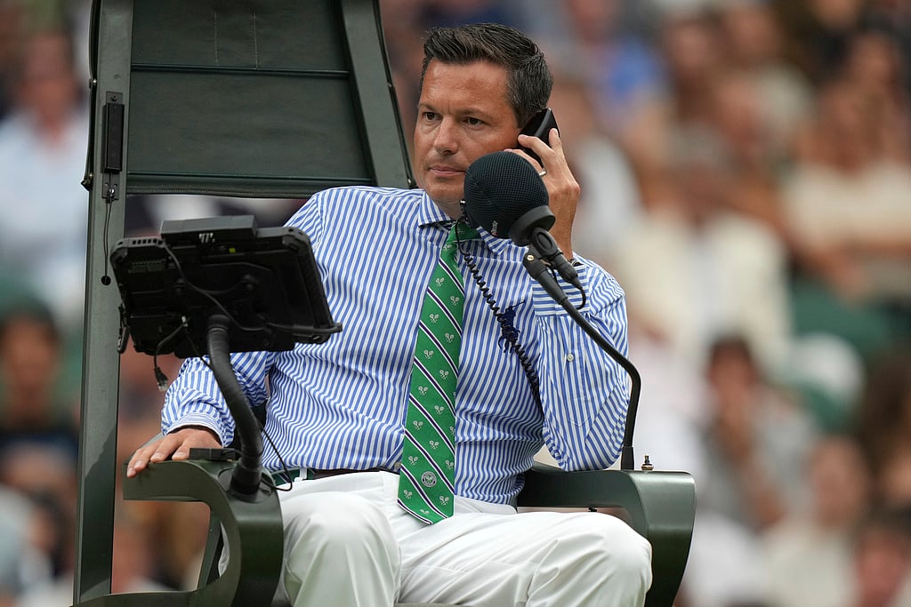 Umpire Nico Helwerth checks on a line call as Russia's Anastasia Pavlyuchenkova plays Sonay Kartal of Britain during a fourth round women's singles match at the Wimbledon Tennis Championships in London.