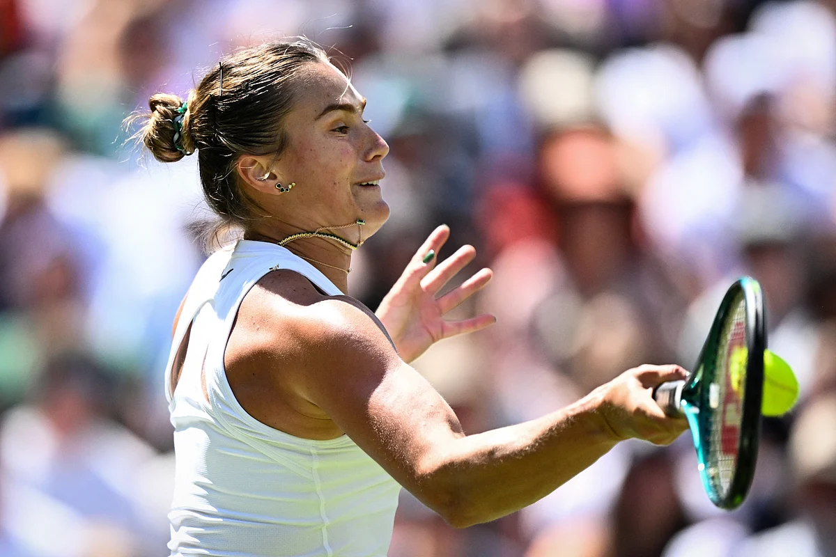 Belarus's Aryna Sabalenka plays a forehand return to Germany's Laura Siegemund during their women's singles quarter-final tennis match on the ninth day of the 2025 Wimbledon Championships at The All England Lawn Tennis and Croquet Club in Wimbledon, southwest London, on July 8, 2025.