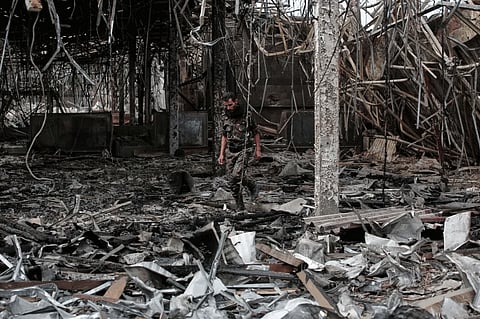 A Yemeni officer inspects the damage following Israeli airstrikes on Sanaa International Airport on May 7, 2025
