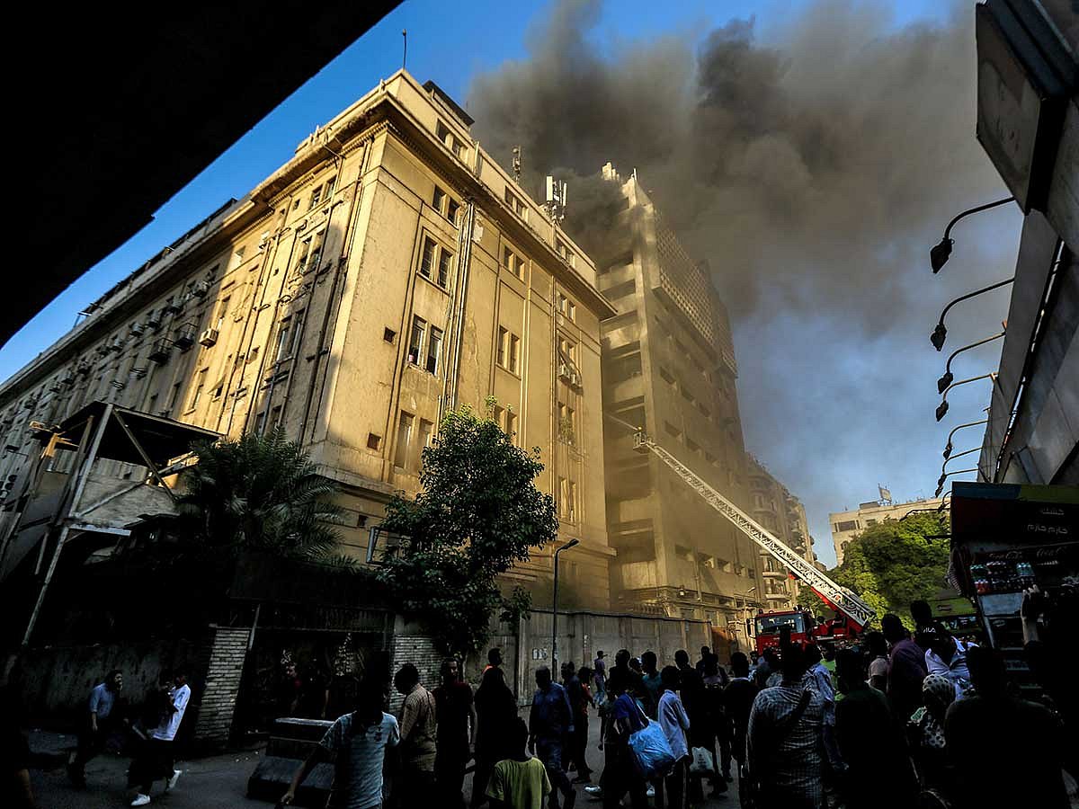 The fire sent thick plumes of smoke billowing into the sky above the densely populated district.