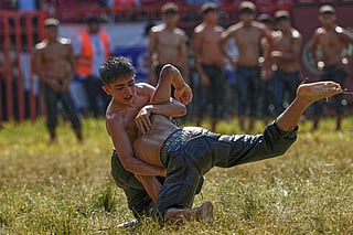 Young wrestlers compete during the 664th annual Historic Kirkpinar Oil Wrestling championship, in Edirne, northwestern Turkey.