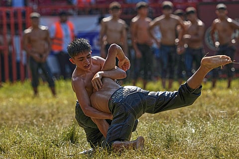 Young wrestlers compete during the 664th annual Historic Kirkpinar Oil Wrestling championship, in Edirne, northwestern Turkey.