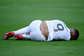 Kylian Mbappe lying down injured