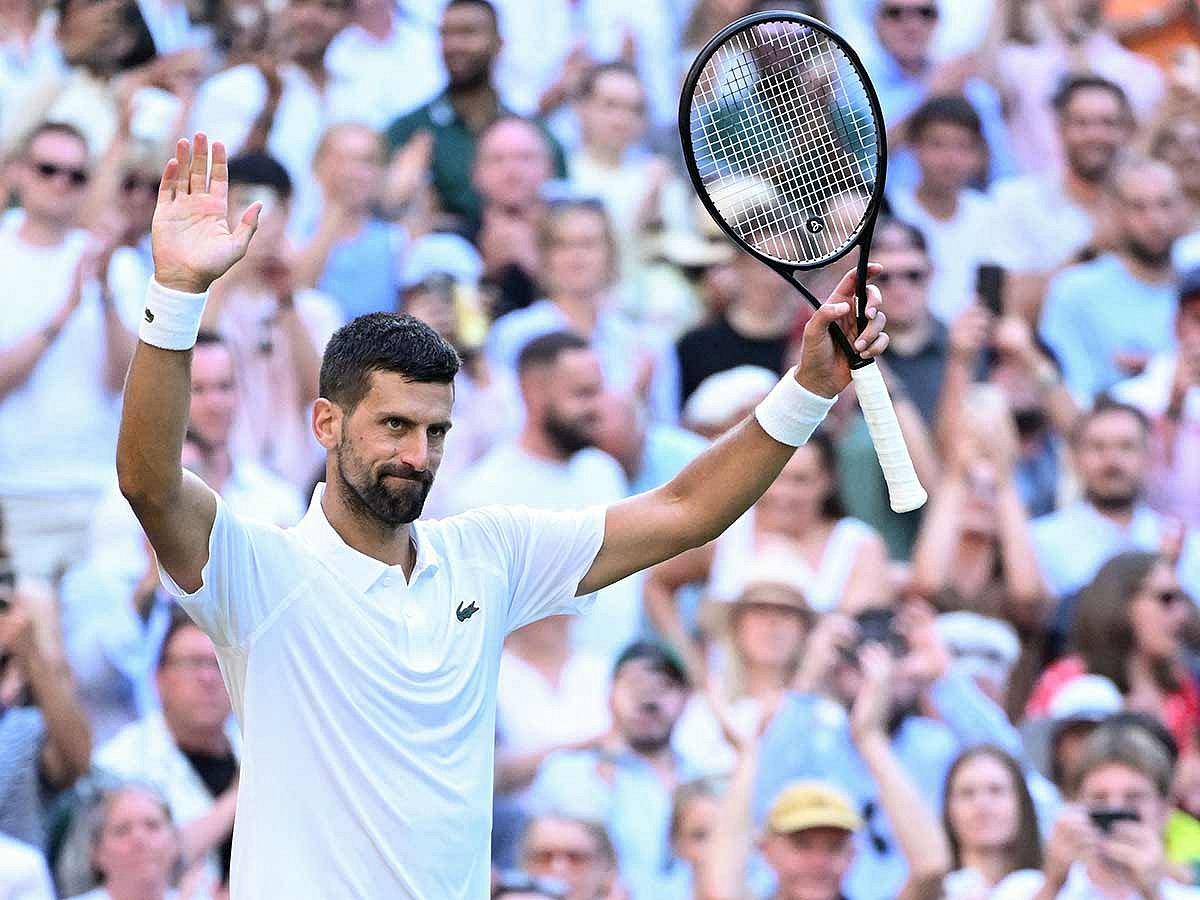 Serbia's Novak Djokovic celebrates after victory Italy's Flavio Cobolli during their men's singles quarter-final tennis match of the 2025 Wimbledon Championships at The All England Lawn Tennis and Croquet Club in Wimbledon, southwest London, on July 9, 2025. 
