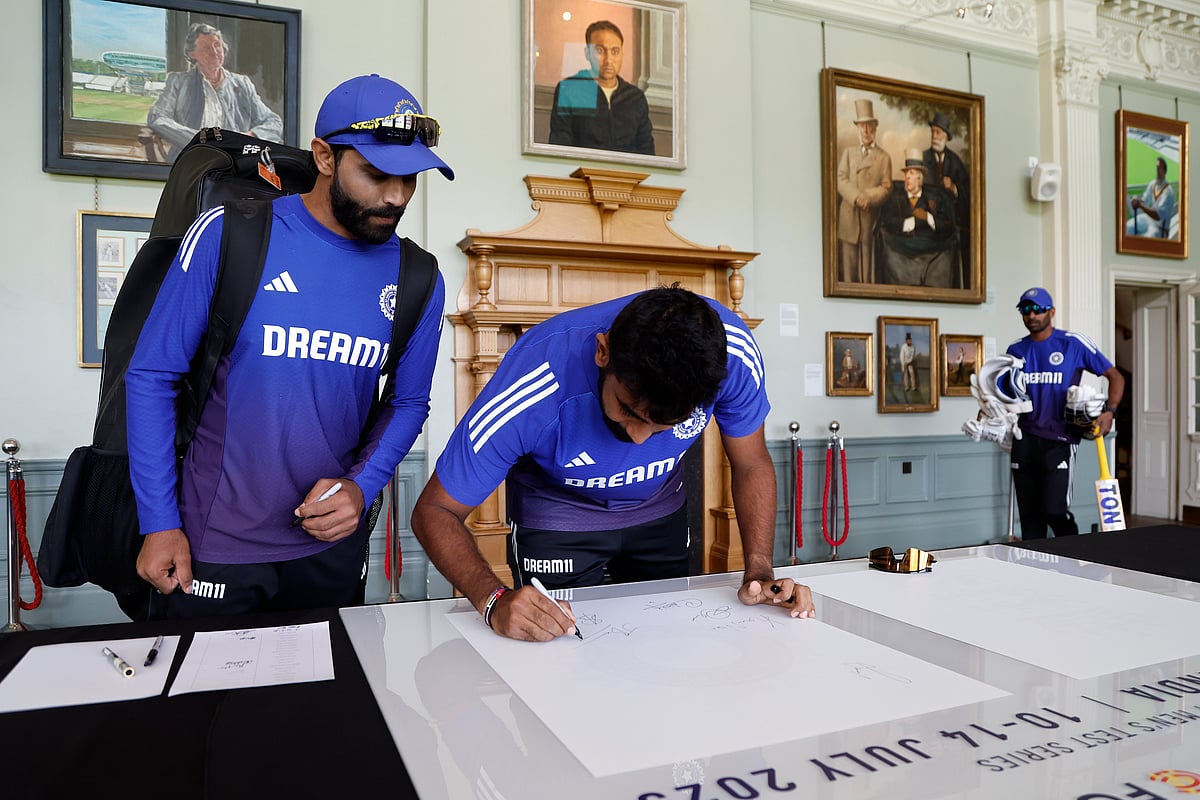 India's Jasprit Bumrah and Ravindra Jadeja signing their autography at the Lord's pavilion on the eve of the third Test on Wednesday.