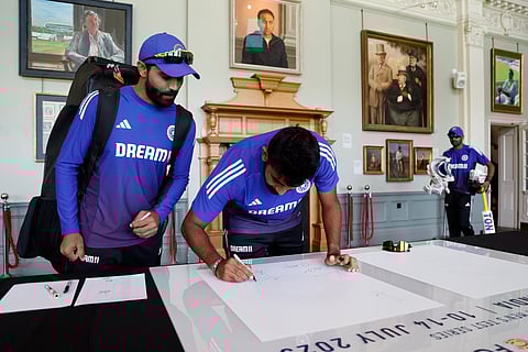 India's Jasprit Bumrah and Ravindra Jadeja signing their autography at the Lord's pavilion on the eve of the third Test on Wednesday.