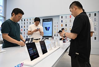 Visitors get a look at the Samsung Galaxy Z Fold7 smartphone at a Samsung store in Seoul on July 10, 2025.