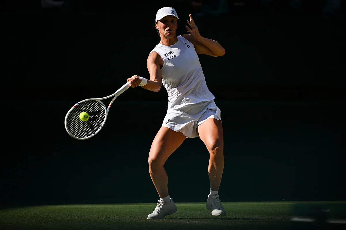 Iga Swiatek routed former Olympic champion Belinda Bencic 6-2, 6-0 on Thursday to reach her first Wimbledon final, where she will face Amanda Anisimova.
