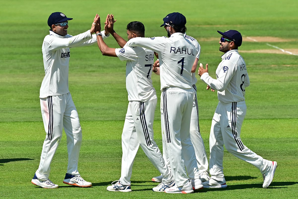 India's Mohammed Siraj (C) celebrates with teammates after taking the wicket of England's Jamie Smith on the second day of the third cricket test match between England and India at Lord's cricket ground in London, on July 11, 2025.