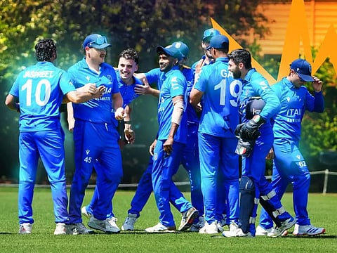 Italy players celebrate after qualifying for the 2026 Twenty20 World Cup.