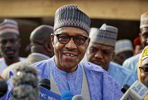 Nigeria's President Muhammadu Buhari speaks to the media after casting his vote in his hometown of Daura, in northern Nigeria, 