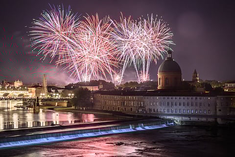 Fireworks explode over the Garonne river, as part of the annual Bastille Day celebrations in Toulouse, southwestern France. Swooping warplanes, axe-carrying warriors, a drone light show over the Eiffel Tower and fireworks in nearly every French town — it must be Bastille Day.
