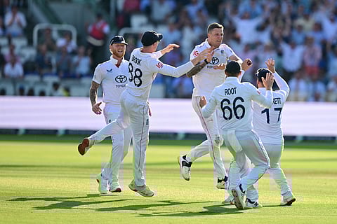 England's Brydon Carse (C) celebrates with teammates after trapping India's captain Shubman Gill LBW (leg before wicket) on the fourth day of the third cricket Test match at Lord's cricket ground in London, on July 13, 2025.