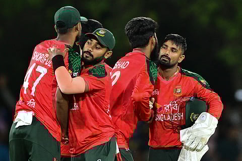 Bangladesh's Litton Das (R) and teammates celebrate after Bangladesh won by 83 runs during the second Twenty20 international cricket match between Sri Lanka and Bangladesh at the Rangiri Dambulla International Stadium in Dambulla on July 13, 2025.