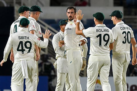 Mitchell Starc (C) of Australia celebrates the dismissal of Kevlon Anderson of West Indies during the 1st day of the 3rd Test between West Indies and Australia at Sabina Park, Kingston, Jamaica, on July 12, 2025.
