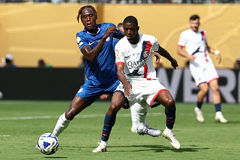 Paris Saint-Germain's French forward Ousmane Dembele (right) battles with Chelsea's English defender Trevoh Chalobah during the Fifa Club World Cup 2025 final football match between England's Chelsea and France's Paris Saint-Germain at the MetLife Stadium in East Rutherford, New Jersey on July 13, 2025.