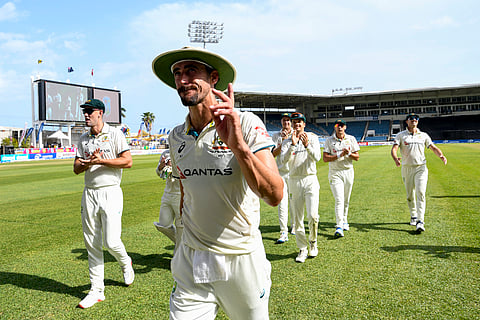 Mitchell Starc (second from left) of Australia walks off the field after decimating the West Indies to their lowest total in Test at Sabina Park in Kingston on Monday.