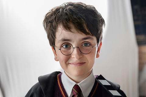 This image released by HBO shows Dominic McLaughlin, who will portray Harry Potter, on the set of HBO series "Harry Potter," scheduled for 2027