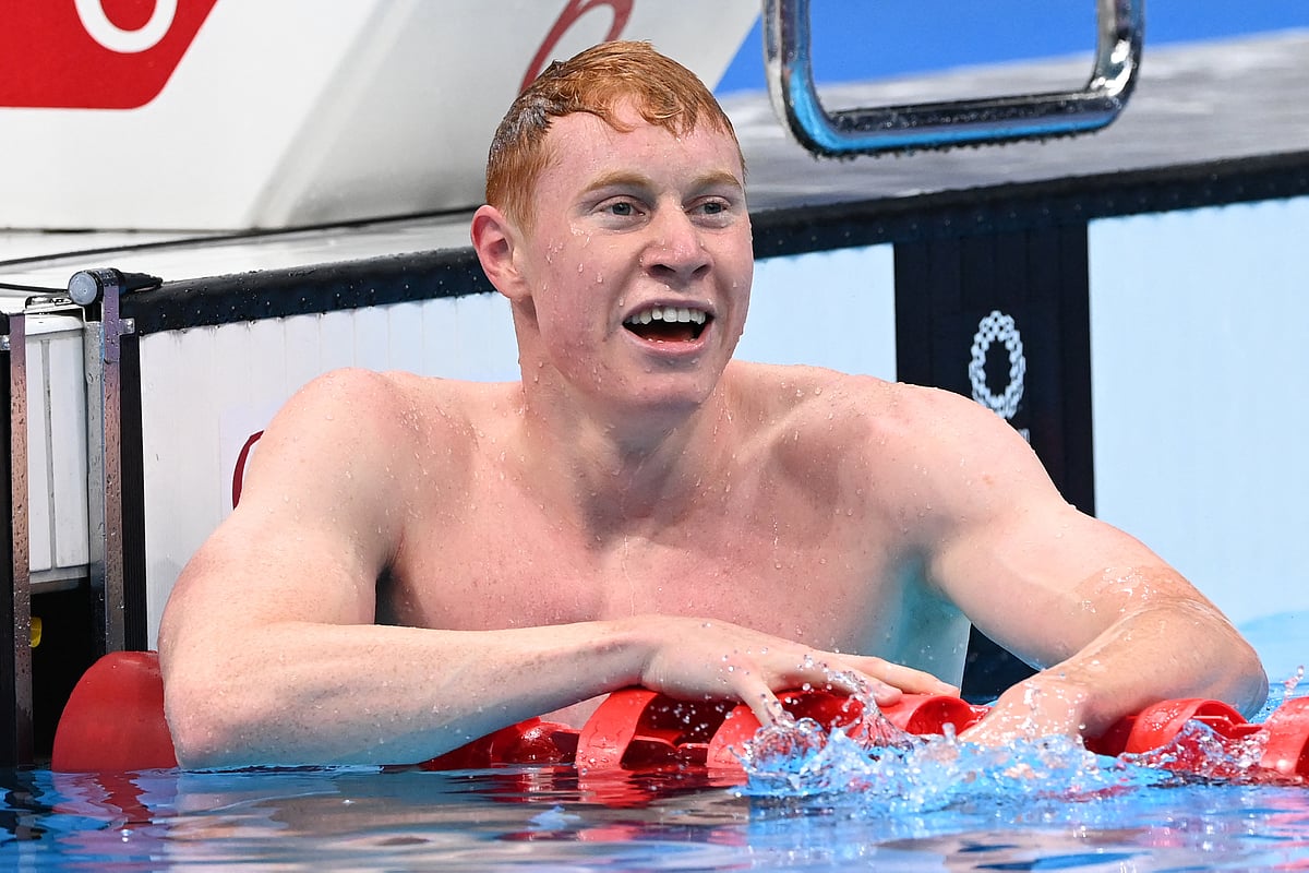 Britain's Tom Dean reacts after winning the final of the men's 200m freestyle swimming event during the Tokyo 2020 Olympic Games at the Tokyo Aquatics Centre in Tokyo on July 27, 2021.