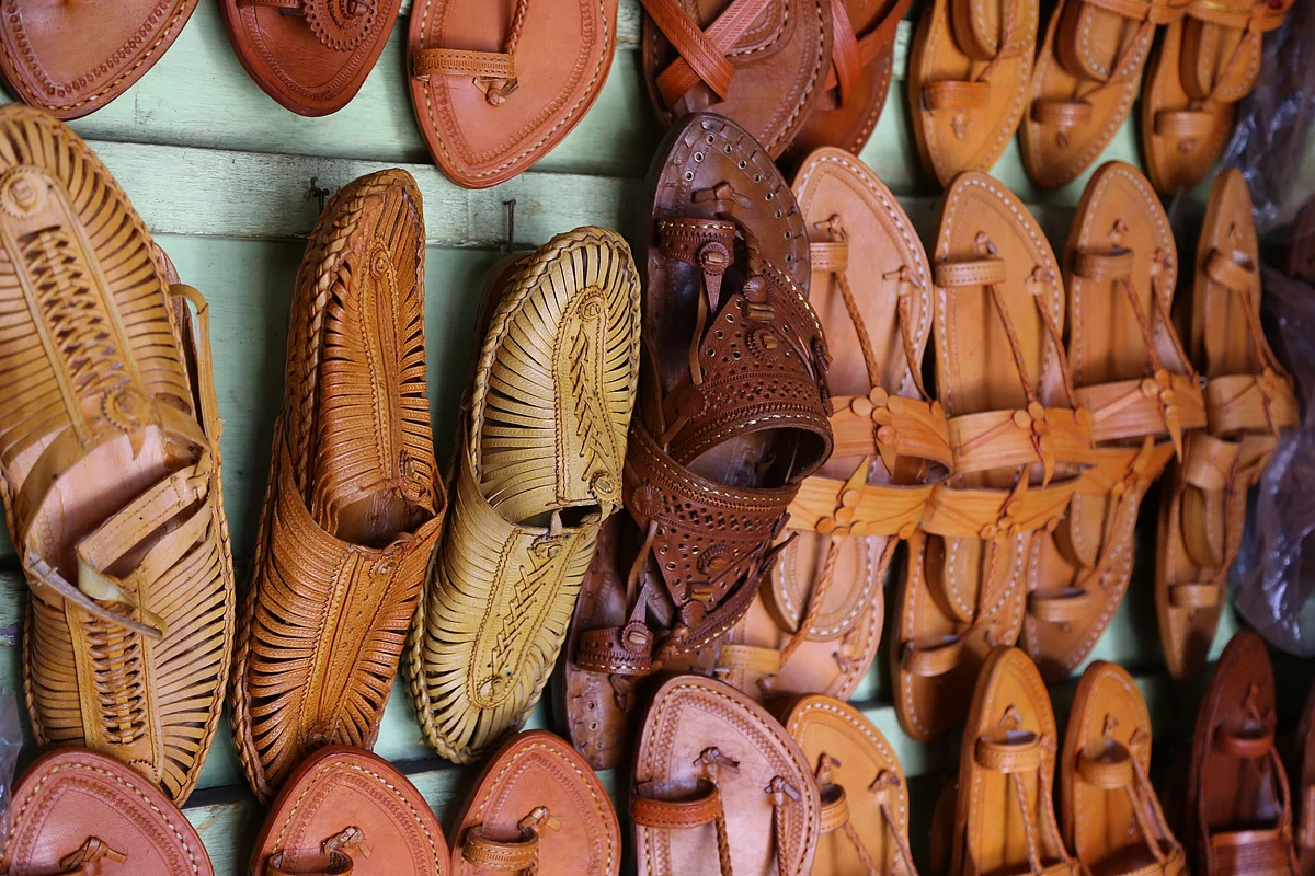 Kolhapuri sandals are traditional, handcrafted leather footwear originating from Kolhapur, a city in the state of Maharashtra, India. Known for their durability, comfort, and intricate craftsmanship, these sandals have been a staple of Indian fashion for centuries.