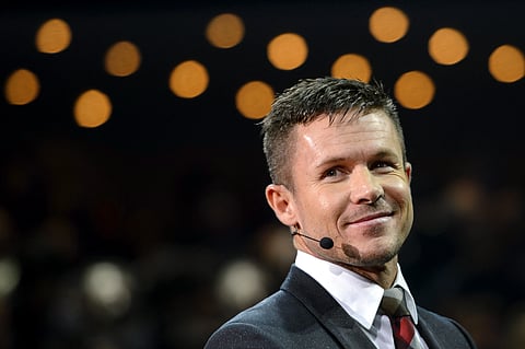 Austrian skydiver Felix Baumgartner looks on a preview of Volkwagen Group on March 4, 2013 ahead of the Geneva Car Show in Geneva.