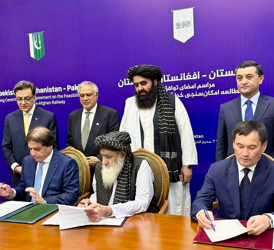 Top officials from Pakistan, Afghanistan and Uzbekistan singing agreement in Kabul for an historic rail link.