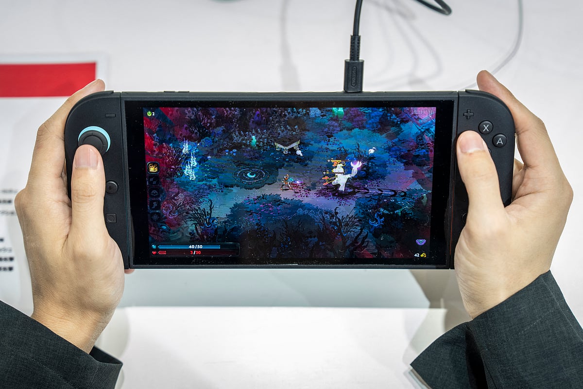 A vistor plays 'Hades 2' an upcoming independent game for Nintendo's Switch 2 during the BitSummit indie gaming expo in Kyoto city, Kyoto prefecture on July 18, 2025.