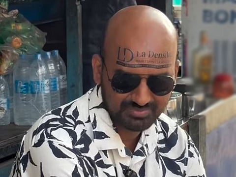Kerala vlogger turns bald head into unique ad space